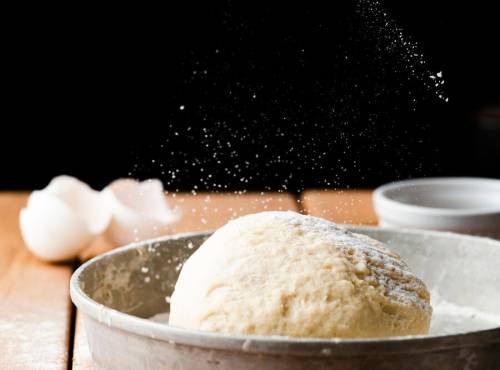 front-view-dough-tray-wooden-table_23-2148288039